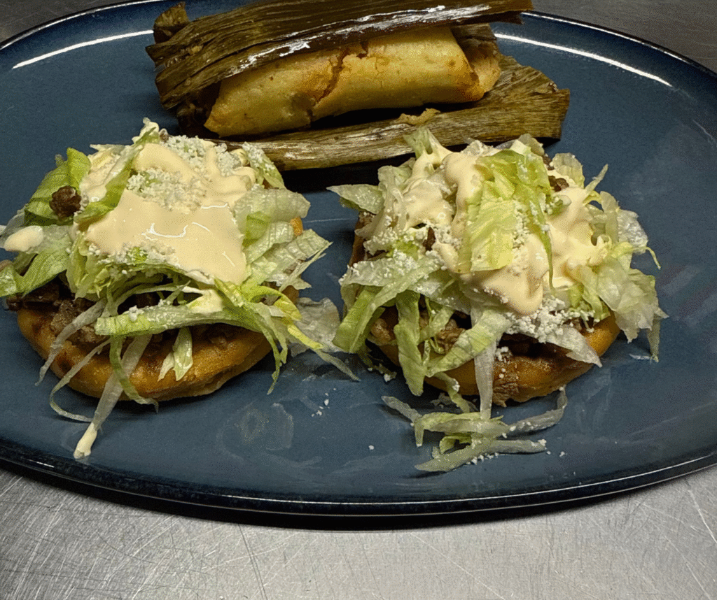 Two steak sopes plus a chicken tamal